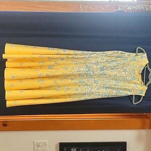 Danny and Nicole yellow dress with blue flowers.